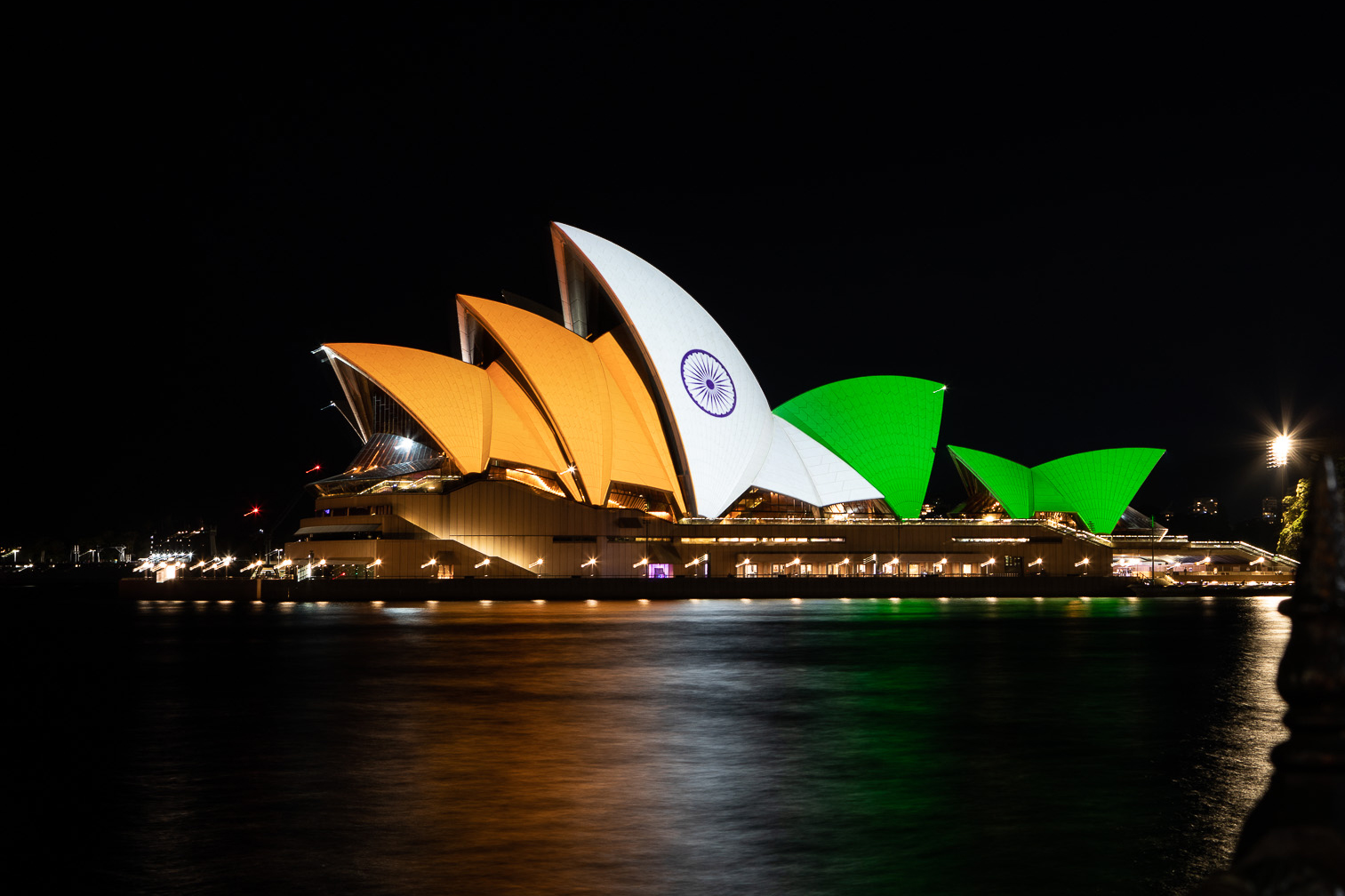 Sydney Opera house at night with light projection of Indian national flag